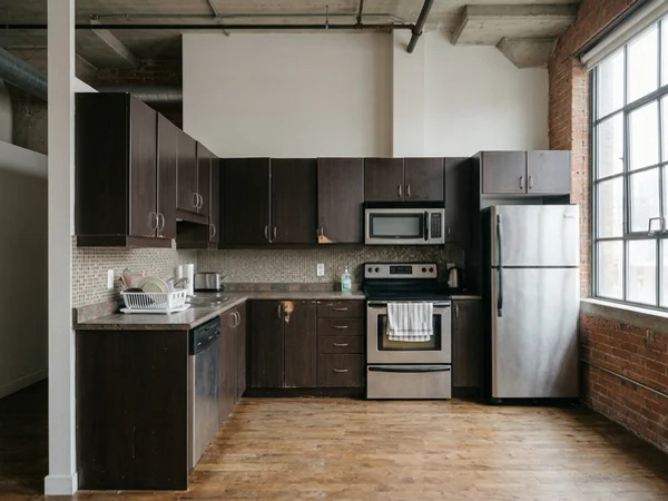 Before: sagging espresso laminate condo kitchen in King West