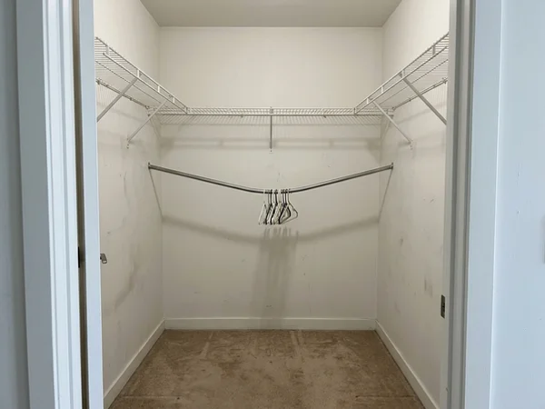 Before: wire shelving in a Liberty Village condo walk-in