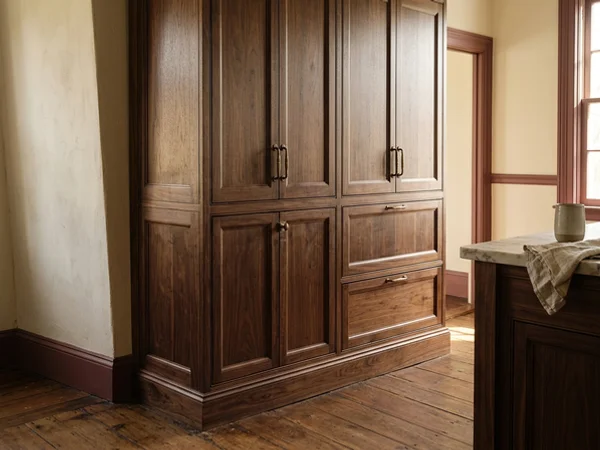 Tall pantry scribed to a sloped floor